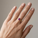 14k Yellow Gold Round Pink Sapphire Ring — on the hand
