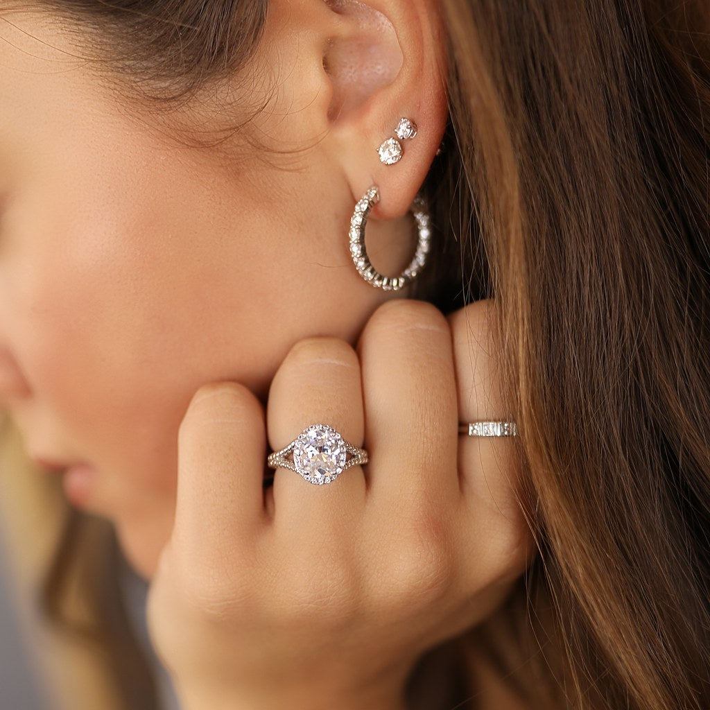 Hoop earrings, rings and a bracelet worn together